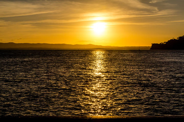 Sunset over the harbour, from the Birkenhead Whard, Waitemata Harbour, Auckland, New Zealand