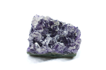Natural Druse of purple amethyst crystal on a white background. Isolated