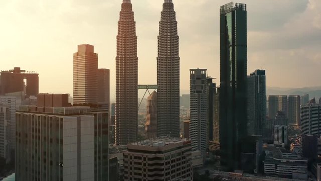 Drone Aerial view 4k Footage of Kuala Lumpur city skyline on sunset in Malaysia.