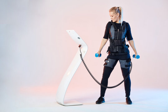 active girl working out with dumbbells. full length photo.copy space.wellness, wellbeing concepts. copy space