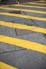 Fototapeta premium Yellow lines painted on the road, showing traffic rules guide for drivers and pedestrians to follow the laws.