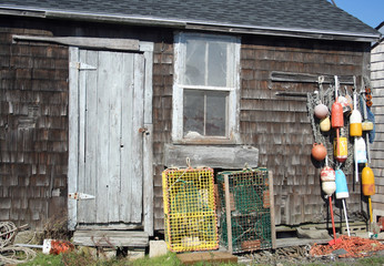 Old lobster shed with buoys and traps
