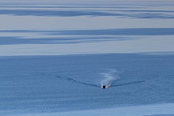 Motor boat in the distance at sea