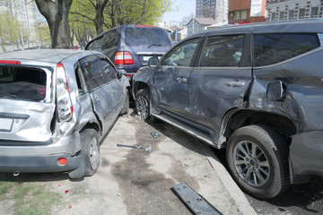 big cars accident on the road in the city, broken cars closeup, traffic accident, multiple car crash