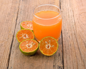 orange juice on wooden background