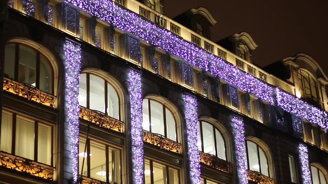 garland decorations on the building at night