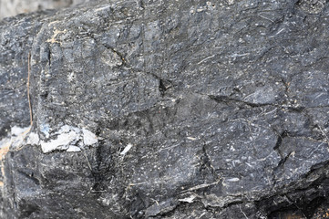 Rock texture and surface background. Cracked and weathered natural stone background.