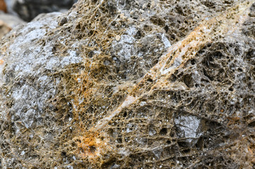 Rock texture and surface background. Cracked and weathered natural stone background.