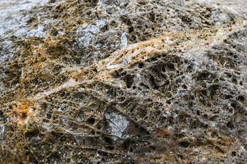 Rock texture and surface background. Cracked and weathered natural stone background.