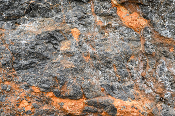 Rock texture and surface background. Cracked and weathered natural stone background.