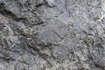 Rock texture and surface background. Cracked and weathered natural stone background.