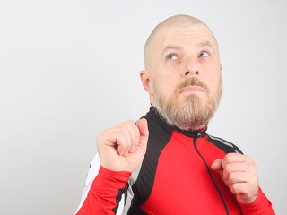 Portrait of a happy bearded man with arms raised