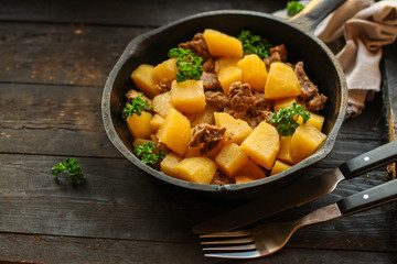 stewed potatoes with meat (goulash with vegetables). food background. top 