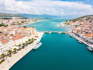 Aerial view of touristic old Trogir, historic town on a small island and harbour on the Adriatic coast in Split-Dalmatia County, Croatia. Ciovski most connects Ciovo and Trogir islands. Kastela gulf