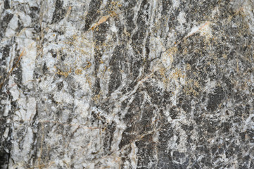 Rock texture and surface background. Cracked and weathered natural stone background.
