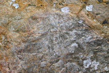 Rock texture and surface background. Cracked and weathered natural stone background.