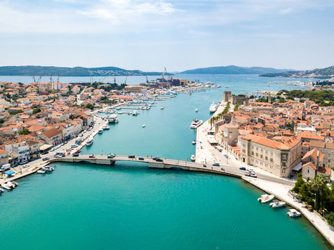Aerial view of touristic old Trogir, historic town on a small island and harbour on the Adriatic coast in Split-Dalmatia County, Croatia. Ciovski most connects Ciovo and Trogir islands. Kastela gulf