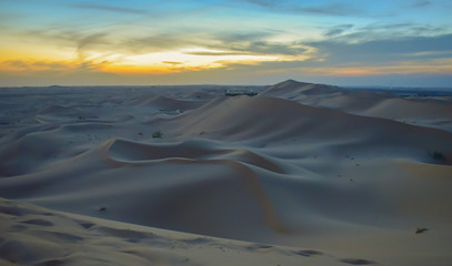 Endless desert sand dunes at sunset near Abu Dhabi