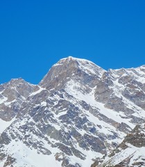 Fototapeta na wymiar View of Monte Rosa on a sunny day near the village of Macugnaga, Italy - April 2019