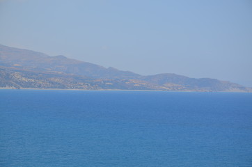 Naklejka premium Greece Crete landscape mountains road panorama sea shore sun beach