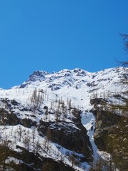 View of the Italian Alps on a sunny day near the town of Macugnaga - April 2019