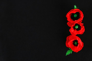 Fototapeta premium Diy paper red poppy Anzac Day, Remembrance, Remember, Memorial day crepe paper on black background.