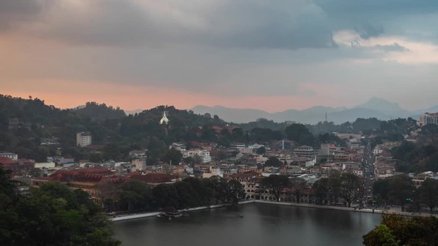 sry lanka timelapse of kandy city of temple view from a hill at sunset with dramatic cloudy sky and traffic
