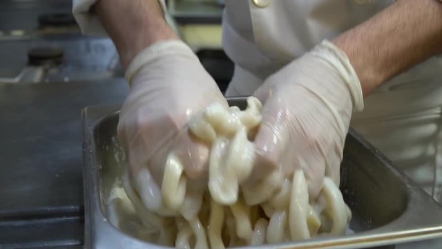 preparing calamar at a fish restaurant