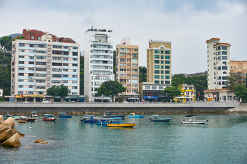 Seaside buildings and fishing boats by the sea