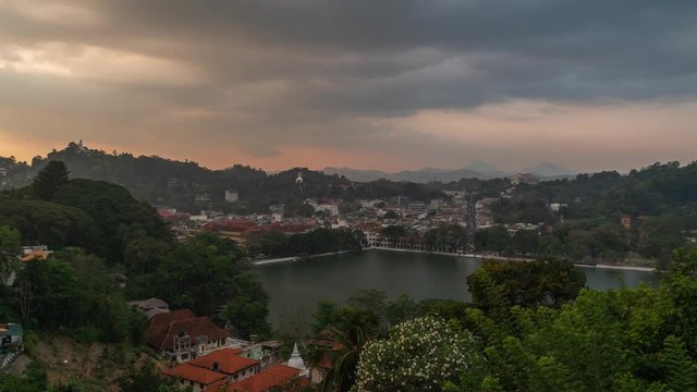 sry lanka timelapse of kandy city of temple view from a hill at sunset with dramatic cloudy sky and traffic