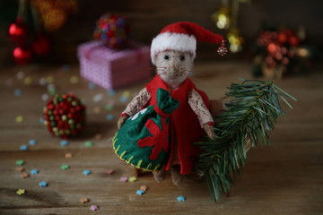 Santa Claus rat with a sack of gifts and Christmas tree. Chinese calendar symbol