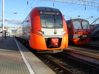 Obraz premium two trains standing at the station