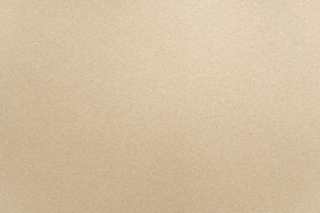 Abstract beige glossy paper texture background or backdrop. Empty light brown cardboard or shiny paperboard for decorative design element. Simple grainy surface for journal template presentation