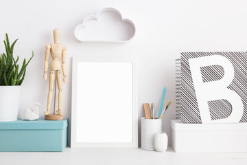 Modern home decor mock up. Creative desk with blank picture frames or poster, desk objects, office supplies, books and plant on a white background.