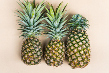 Fototapeta premium High angle view of fresh pineapple on grey background
