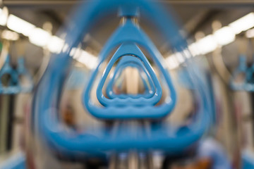 blue Handrails in a train
