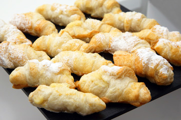 Delicious baked croissants on the table