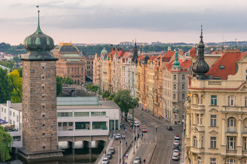 Fototapeta premium Panoramic view of Prague historic waterfront architecture at sunset