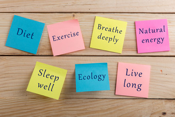 Diet plan and motivation be healthy concept - Many colorful sticky note with words diet, exercise, breathe deeply, natural energy, sleep well, ecology, live long