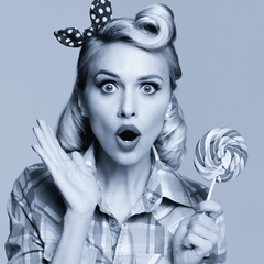 beautiful woman with lollipop, dressed in pin-up style