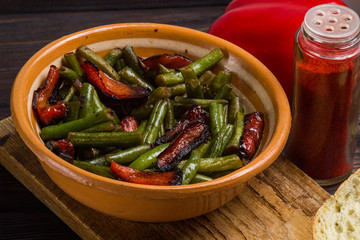 Fried green beans with red pepper, bread, garlic. Vegetarian food.