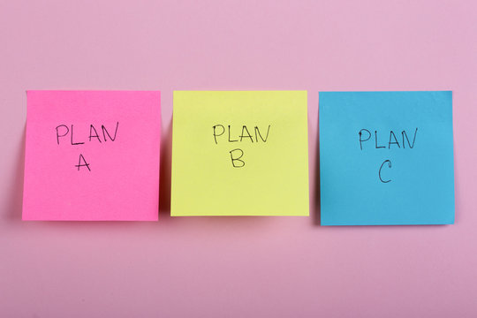 Plan a, plan b or plan c on colorful office stickers on pink background