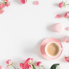 Flowers composition romantic. Flowers roses and rose petals, macaroon, cup coffee on white background. Happy women's day. Valentine's Day. Flat lay, top view 