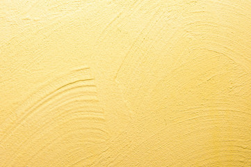 abstrakter, strukturierter Hintergrund: gelber Putz