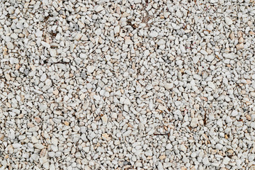 White pebble stone texture on the ground
