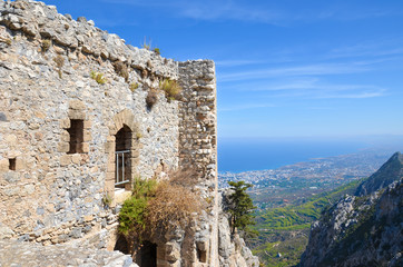 Ruins of historical Saint Hilarion Castle in Northern Cyprus overlooking the Mediterranean sea and its coast by the city Kyrenia. The amazing view point is a popular tourist attraction