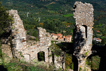 Fototapeta na wymiar Part of the byzantine archaeological site of Mystras in Peloponnese, Greece. View of the remains of buildings in the middle city of the ancient Mystras