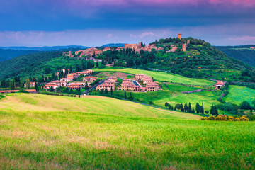 Picturesque Tuscany cityscape with grain fields, Monticchiello, Italy, Europe