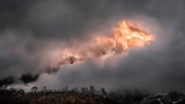 Manaslu mountain peak (Himalayas mountains, Nepal) - sunrise in stormy weather clouds - creative timelapse 4K