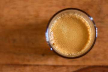 cup of coffee on a wooden table